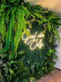Vertical Garden Wall with Neon Sign