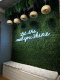 Vertical Garden Wall with Blue Neon Sign
